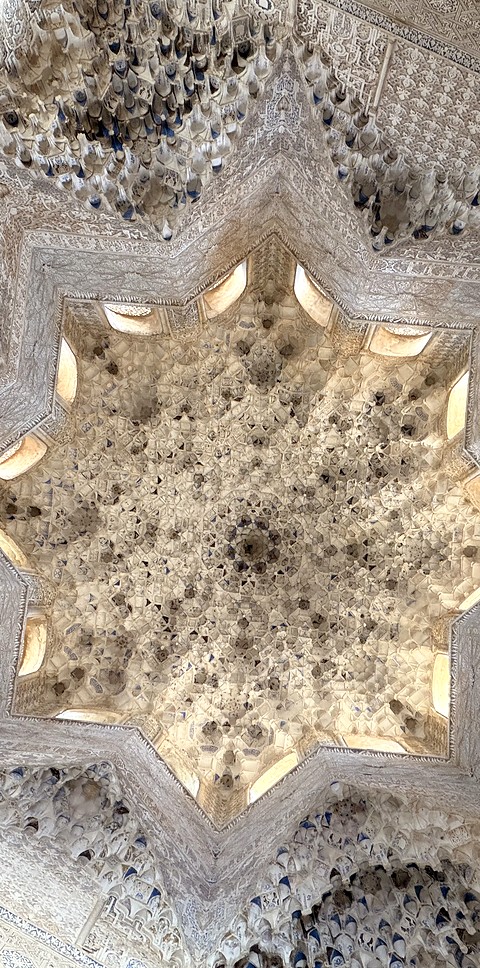 A muqarnas star, opening to the light